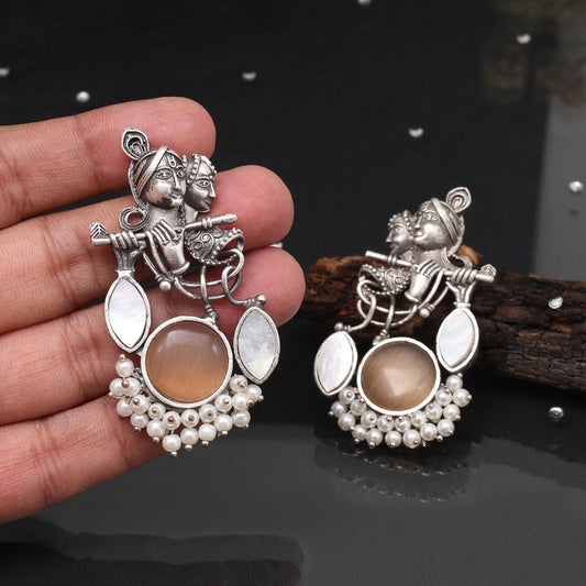 Peach Color Oxidised Earrings With Elegant Radha Krishna Artistic Motif