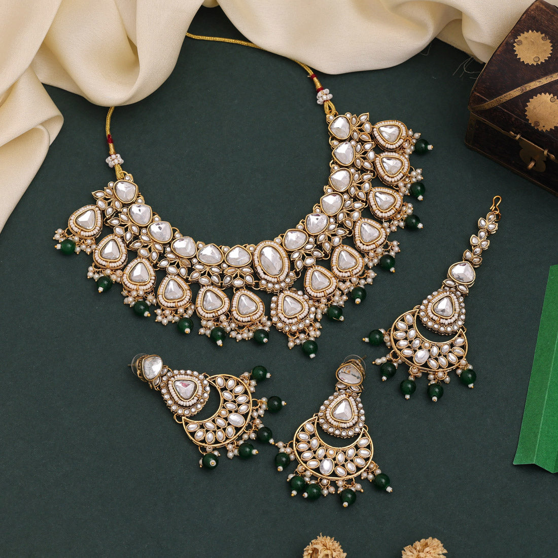 Green Color Kundan Necklace Set With Traditional Detailing And Charm