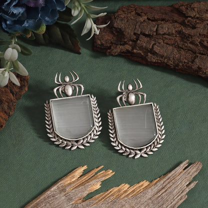 Grey Color Oxidised Earrings Featuring Floral Pattern With Tribal Touch